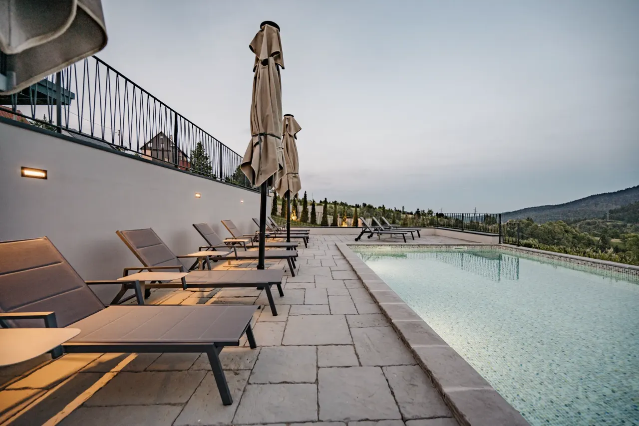 Poolside loungers in the calm of evening