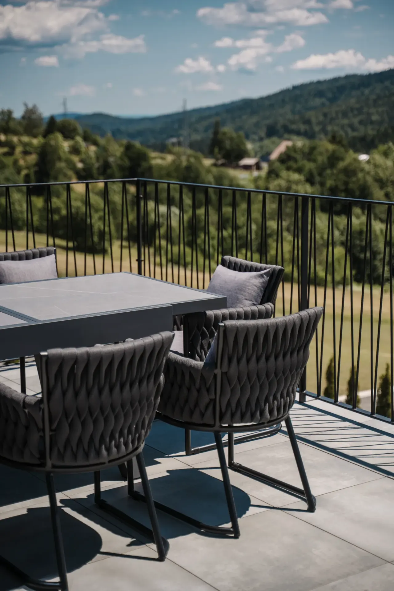 Alfresco dining table on the terrace with panoramic hill views