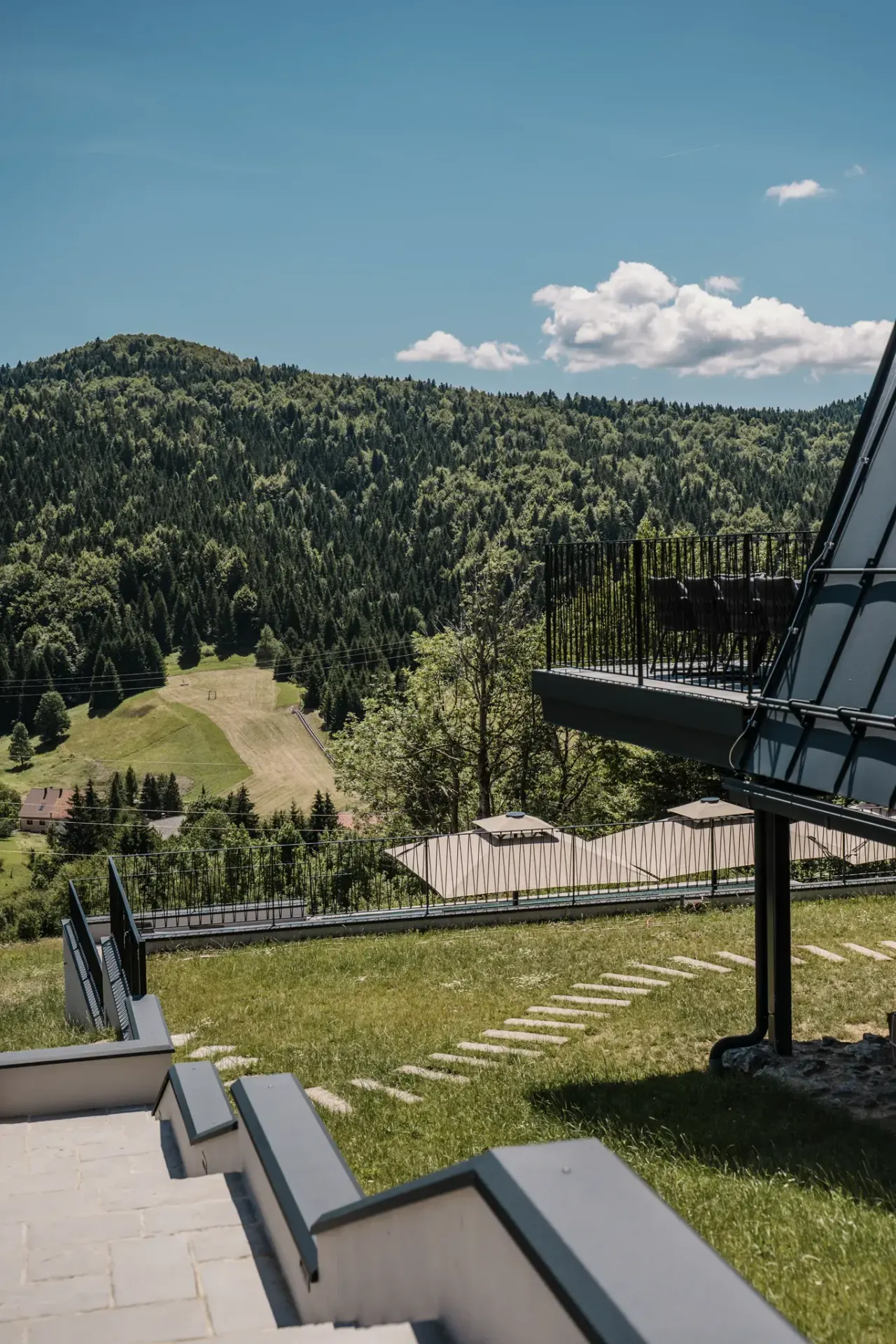 Open hillside and meadow falling away toward the Gorski kotar valley