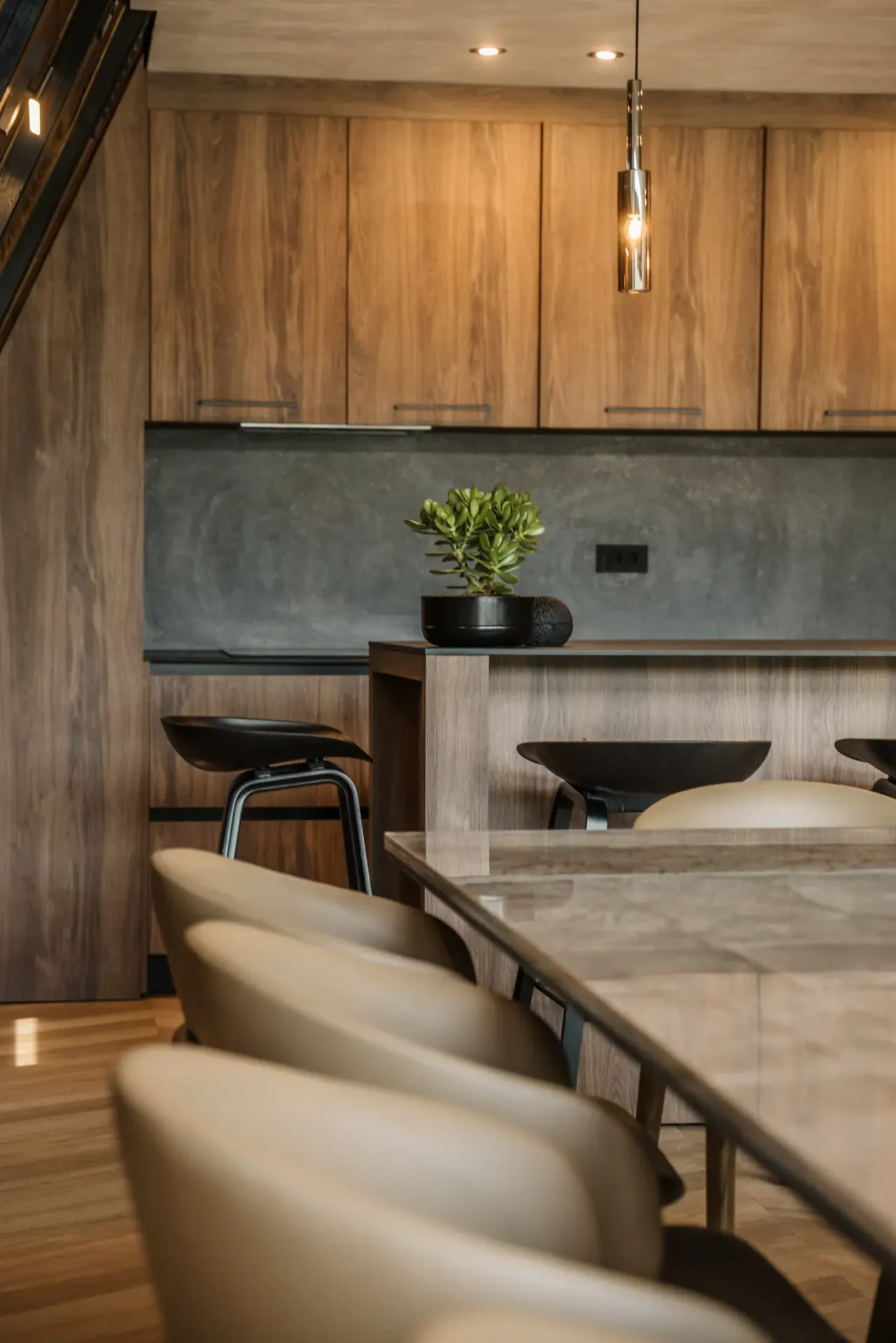 Timber kitchen with island, bar stools and pendant lighting