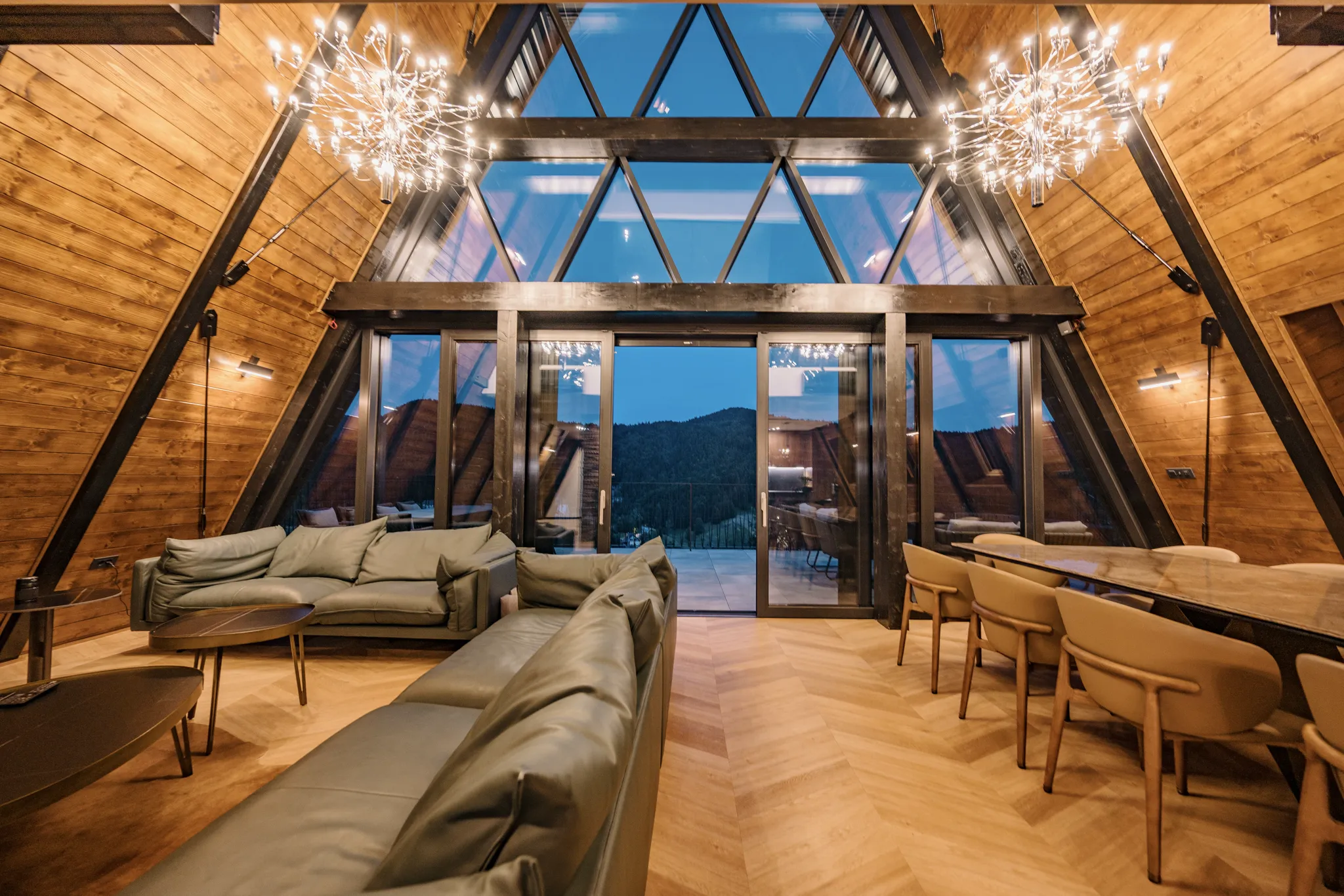 The A-frame villa standing alone against the Gorski kotar forest on the highest shoulder of Ravna Gora, the 13 m glass gable catching first light